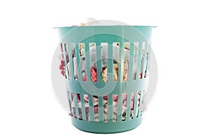Green laundry basket full of clothes on white background , wit