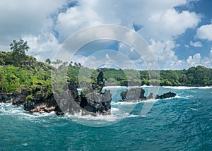 Green lava rocks at Waianapanapa on the road to Hana in Maui