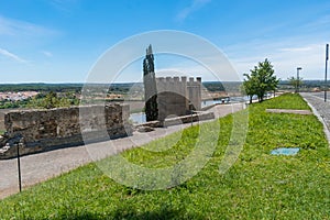 Green lawn in the inner park of the castle wall with tower, AlcÃ¡cer do Sal - PORTUGAL photo