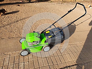 Green lawnmover sprayed photo