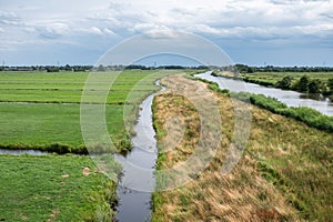 Green lawns and canals at the natural flood zones of the Reeuwijkse plassen in Reeuwijk, The Netherlands