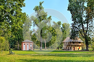 Green lawns among trees in Racconigi Park, Italy.