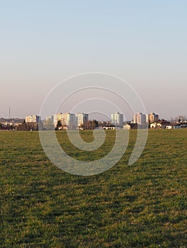Green lea and blocks of flats in Bielsko-Biala city, Poland - vertical