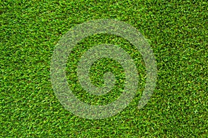Green artificial grass background vignette or the naturally walls texture Ideal for use in the design fairly. photo