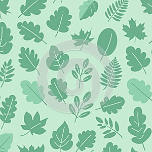 Green leaves pattern on a light green background. The design features a variety of leaf