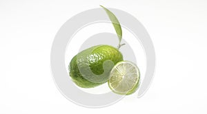 Green lemon full and slice isolated on a white background with clipping path