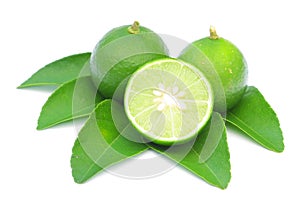 Green lemon with leaves isolated on white