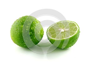 Green lemon with water droplets