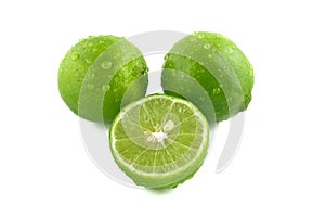 Green lemon with water droplets