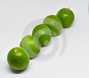 Green lemon on white background.
