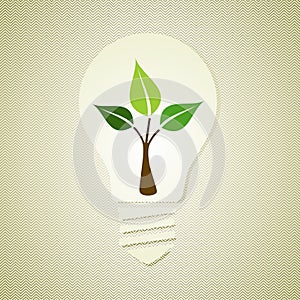 Green light bulb with leaves