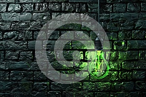 Green light is shining on a brick wall.