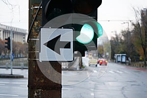 Green light and shows that we can turn left, day photo, intersection, city, traffic.