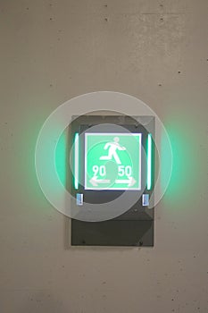 Green light shows the way to the emergency exit when driving in the tunnel