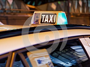 Green Light on taxi sign at night