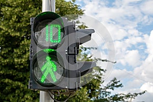 Green light at traffic lights for pedestrians.