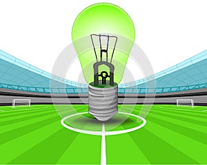 Green lightbulb in the midfield of football stadium vector