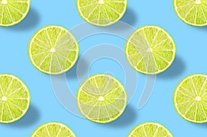 Green lime slice pattern on colorful background