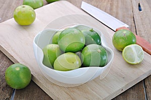 Green lime on white dish.