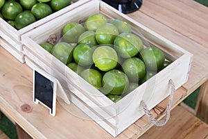 The green lime in the wood box.