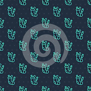 Green line Christmas stocking icon isolated seamless pattern on blue background. Merry Christmas and Happy New Year