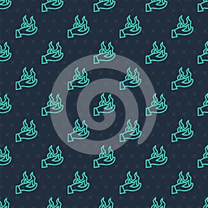 Green line Hand holding a fire icon isolated seamless pattern on blue background. Vector