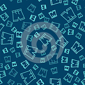 Green line Swimming trunks icon isolated seamless pattern on blue background. Vector