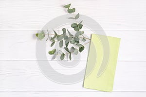Green linen kitchen towel om white wood background