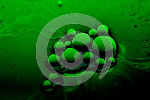 Green liquid with bacteria, viruses in an experiment, molecular or in outer space, non-human