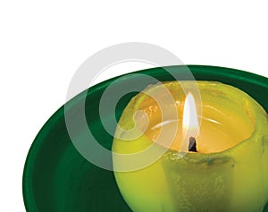 Green lit candle macro closeup, isolated glowing flame
