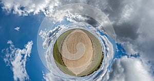 green little planet wit gravel road transformate with curvature of space