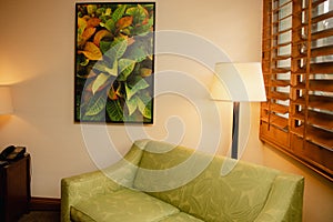 Green liveing room interior design- silkcough with floor lanp and floral print photo