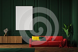 Green living room with red sofa and poster