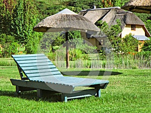 Green lounger on lawn