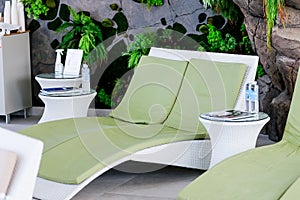 Green loungers by the pool at the luxury spa.