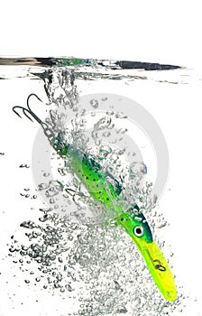 Green lure making a splash in water on white background