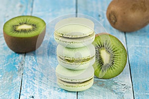 Green macarons and fresh kiwis