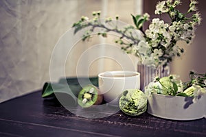 Green macarons on a wood table for coffee or a tea