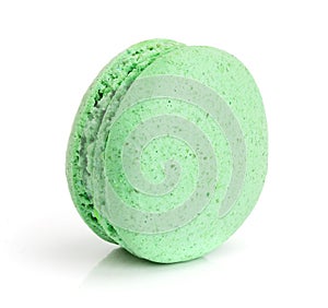 Green macaroon isolated on white background closeup
