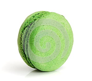 Green macaroon isolated on white background closeup