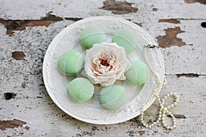 Green Macaroons on a White Plate