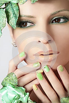Green makeup and nail Polish.
