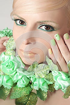 Green makeup and nail Polish.