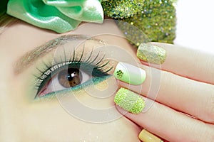 Green makeup and nail Polish.