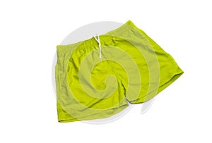 Green, male swimming trunks on a white background