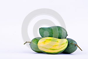 Green mango peeled and three fresh green mangoes on white background healthy fruit food isolated