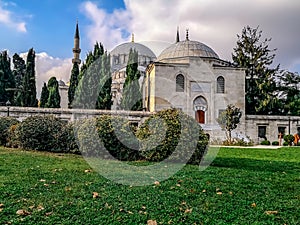 Green manicured lawn in the garden of the Suleymaniye Mosque in Istanbul Turkey in an autumn day. Beautiful public park with