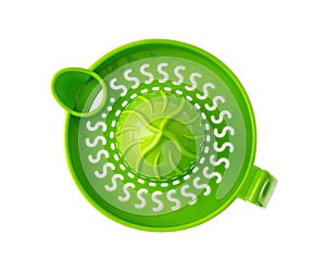 Green manual citrus juicer with handle isolated on white background. Modern plastic citrus press for squeezing fresh juice from