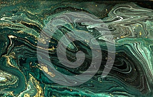 Green marble abstract acrylic background. Marbling artwork texture. Agate ripple pattern. Gold powder.