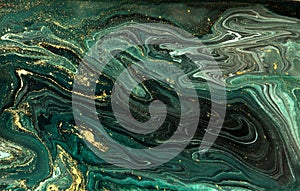 Green marble abstract acrylic background. Marbling artwork texture. Agate ripple pattern. Gold powder. photo